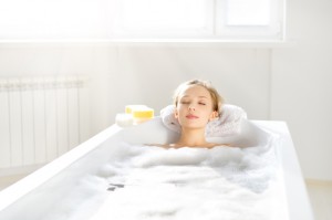 An Attractive girl relaxing in bath